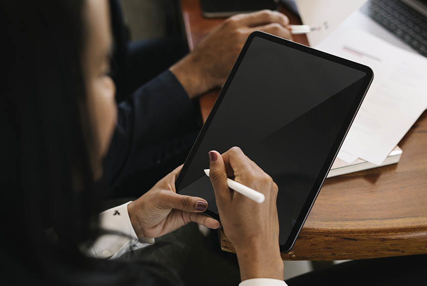 Woman using a pen for tablets