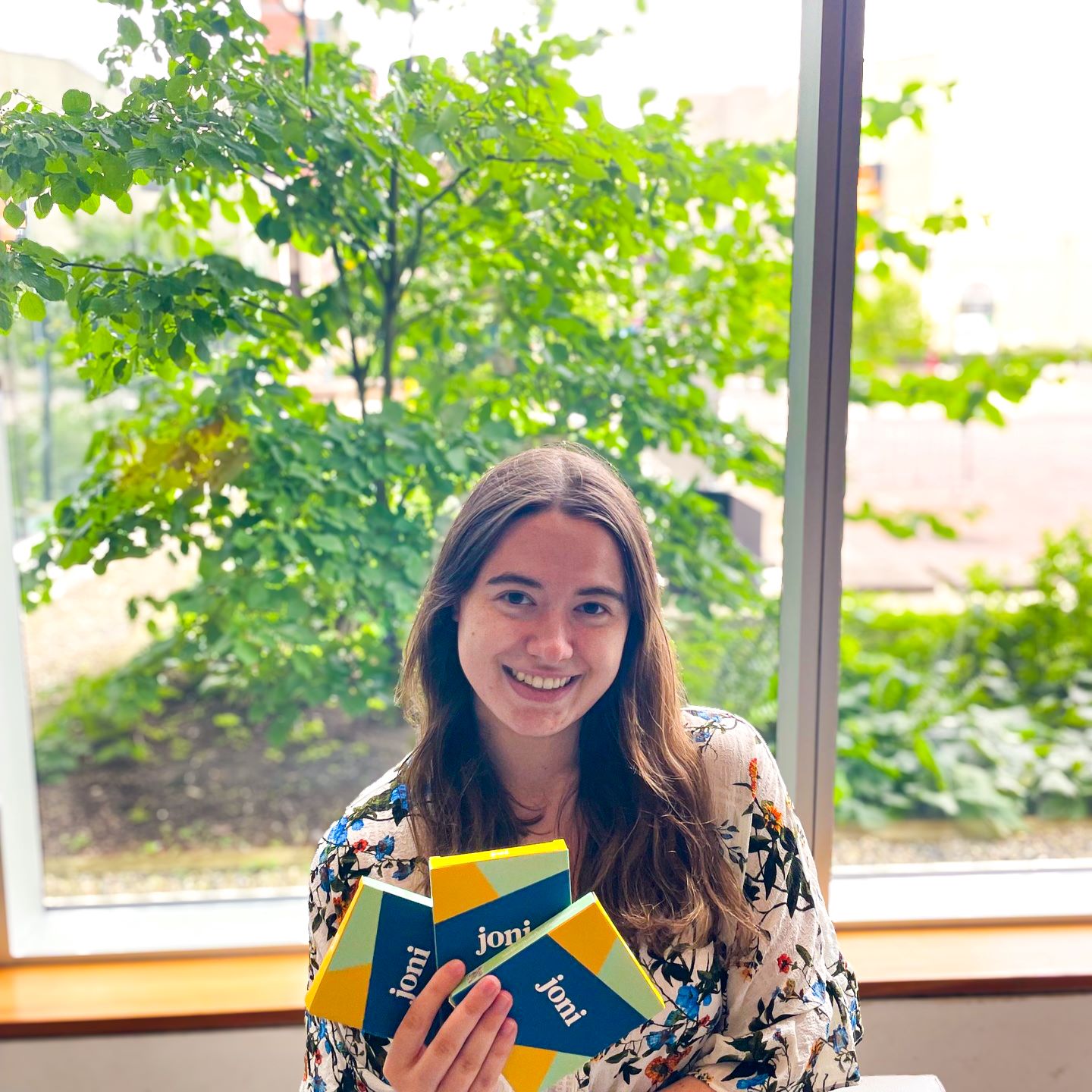 A student holding menstrual pads