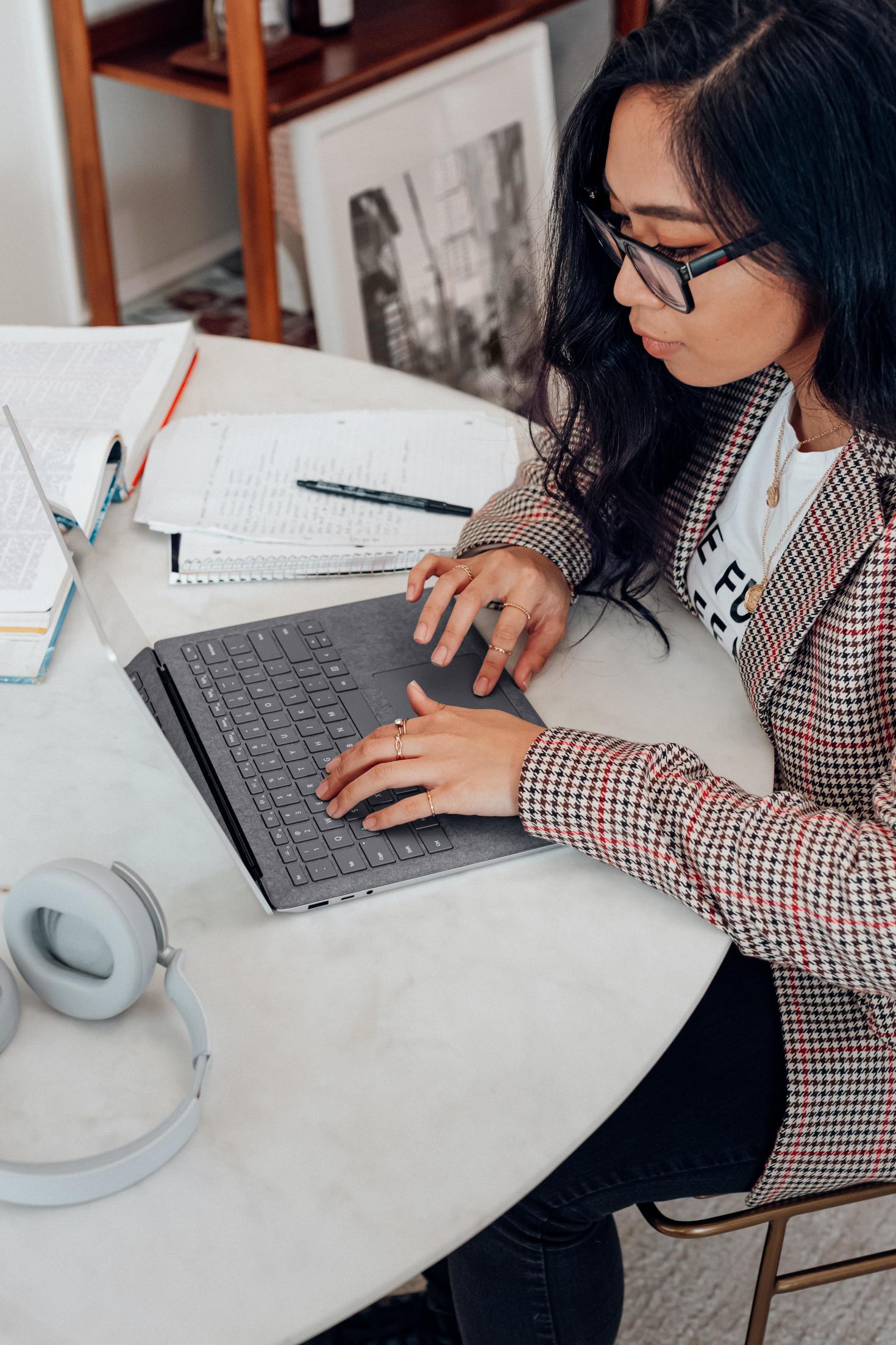 A woman working on her laptop