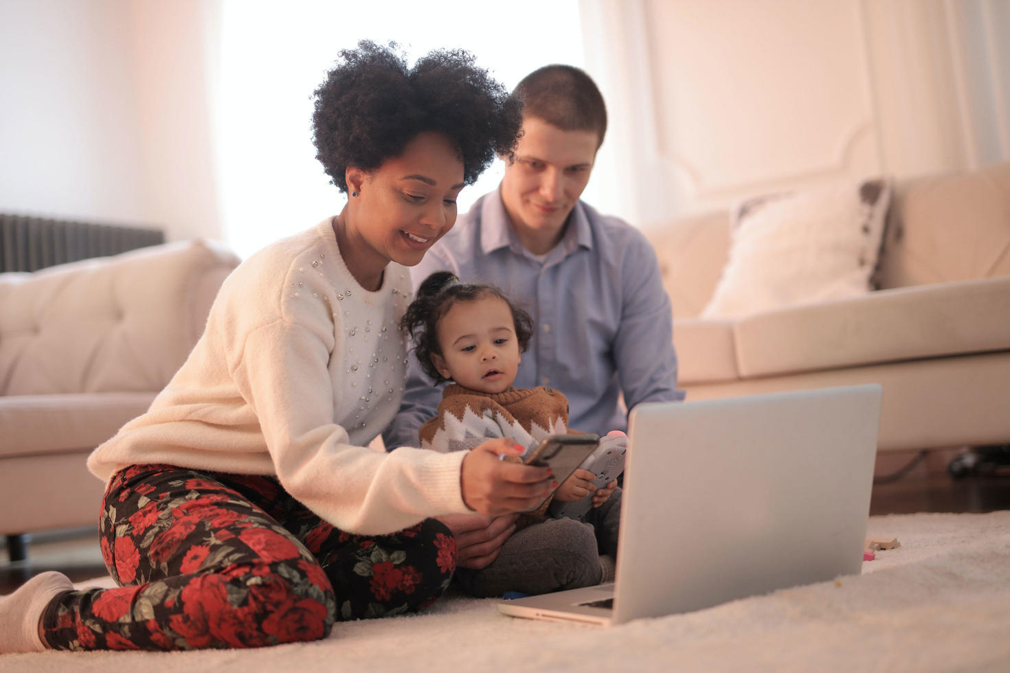 A family looking at a laptop screen