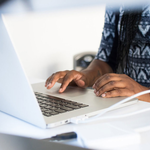 A person using a laptop to search.