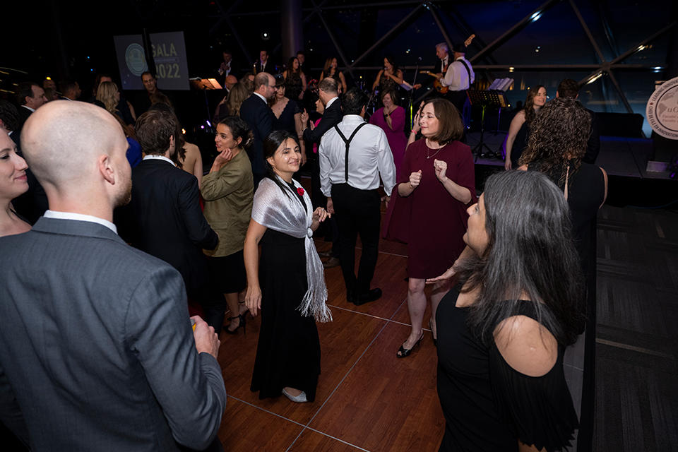 a group of people dancing in a ballroom