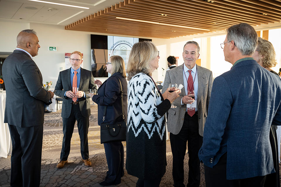 a group of people mingling in a room