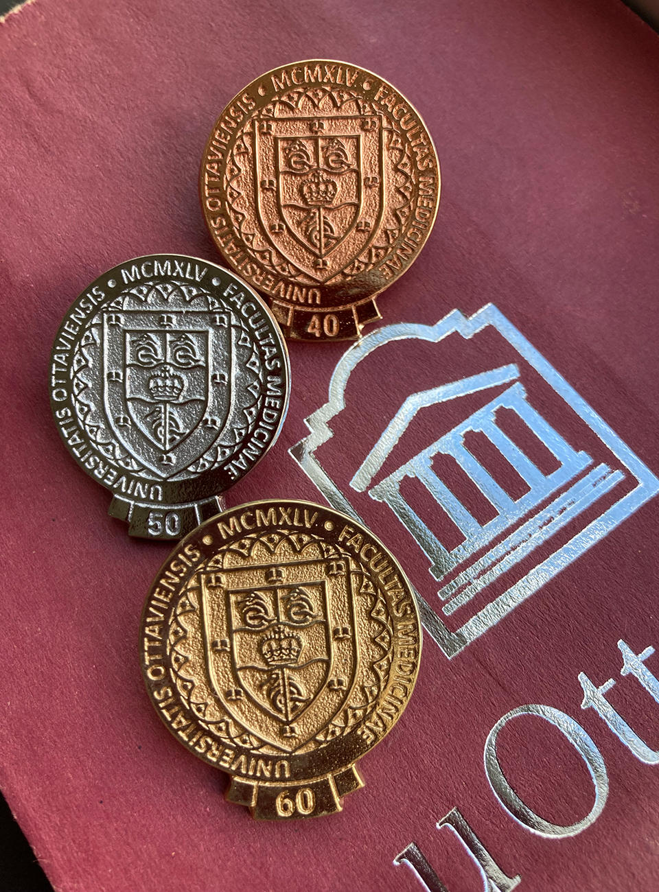 Bronze, silver and gold pins