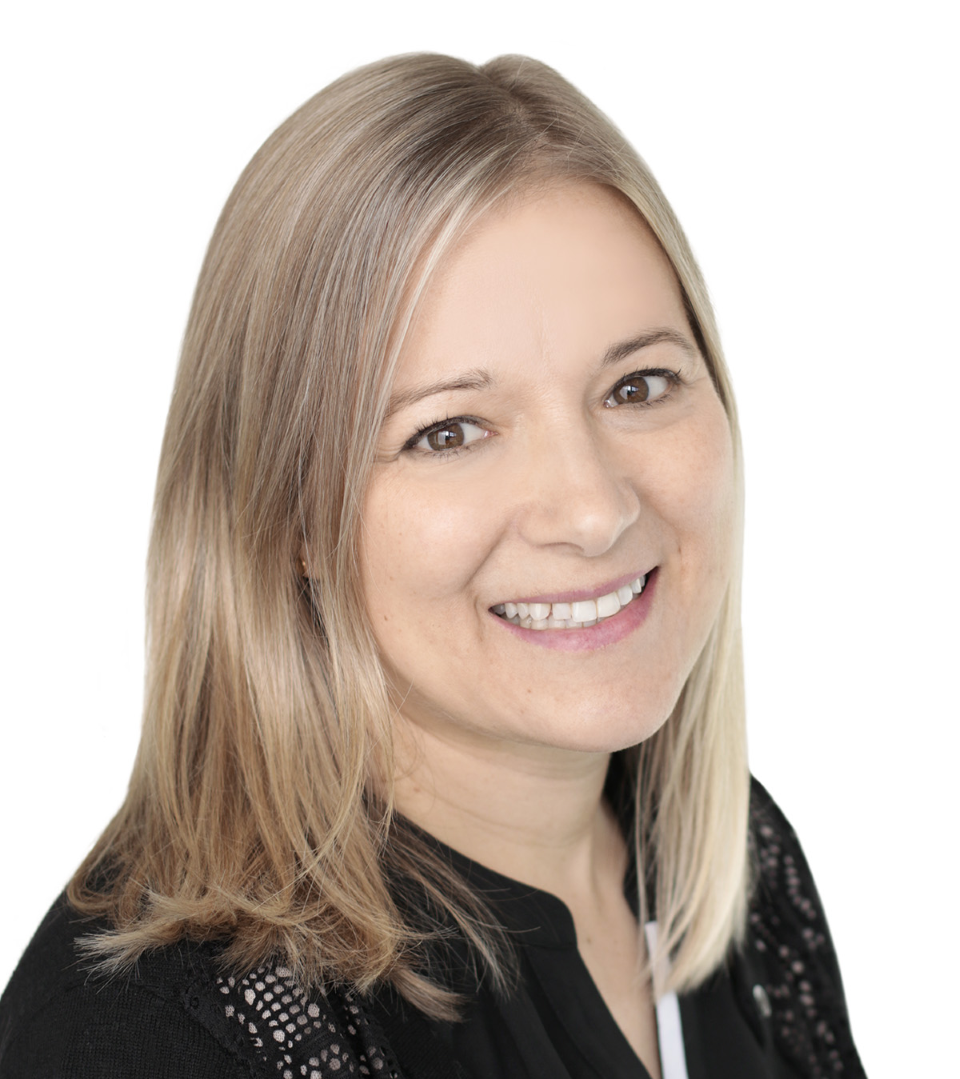 Dr. Annie Robitaille smiling with a blank background.