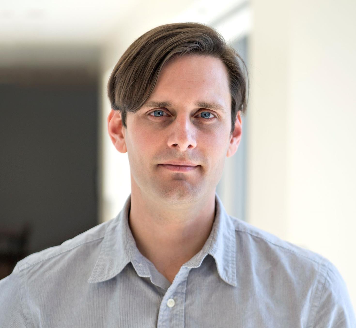 Picture of Dr. Clifford Cassidy standing in a hallway.