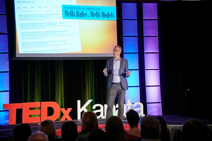 Photo of Dr. Phil Wells on stage at TedXKanata