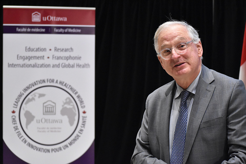 The president of the University of Ottawa speaks to the crowd.