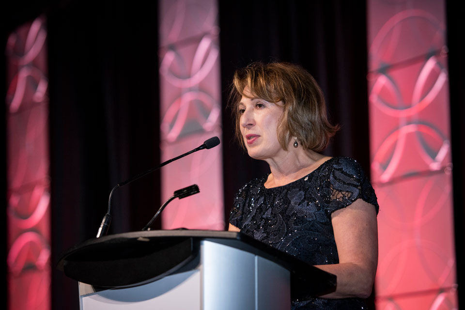 Dr. Mona Nemer, Chief Science Advisor of Canada and Professor at the University of Ottawa Faculty of Medicine, stands on stage to deliver a speech at the CMHF Induction ceremony.
