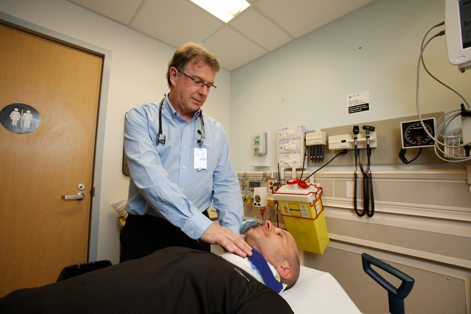 Dr. Stiell tends to a patient