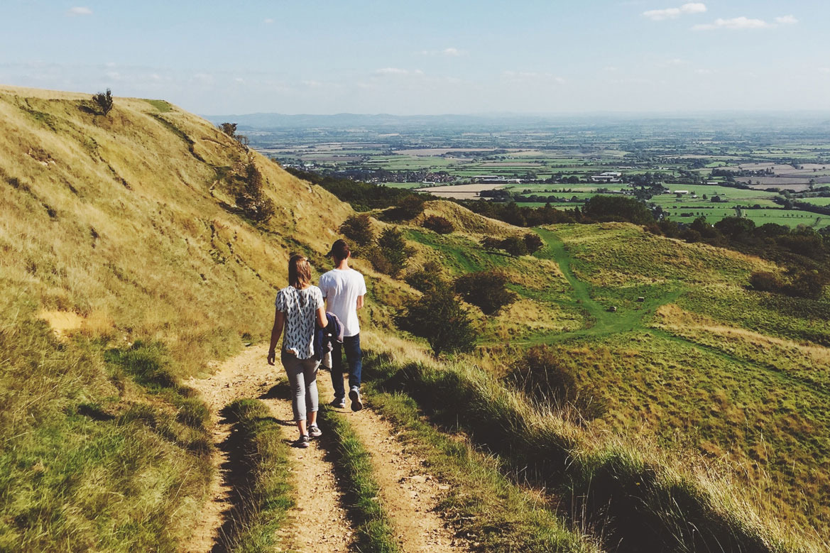 Two people enjoying a walk in the countryside.